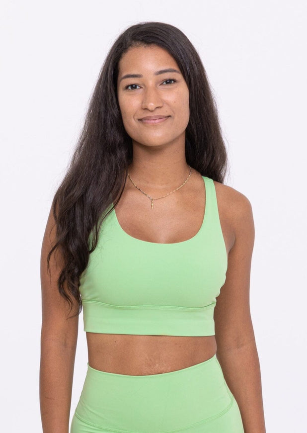 Woman 37 years old green sport bra Outdoor Lawn in background